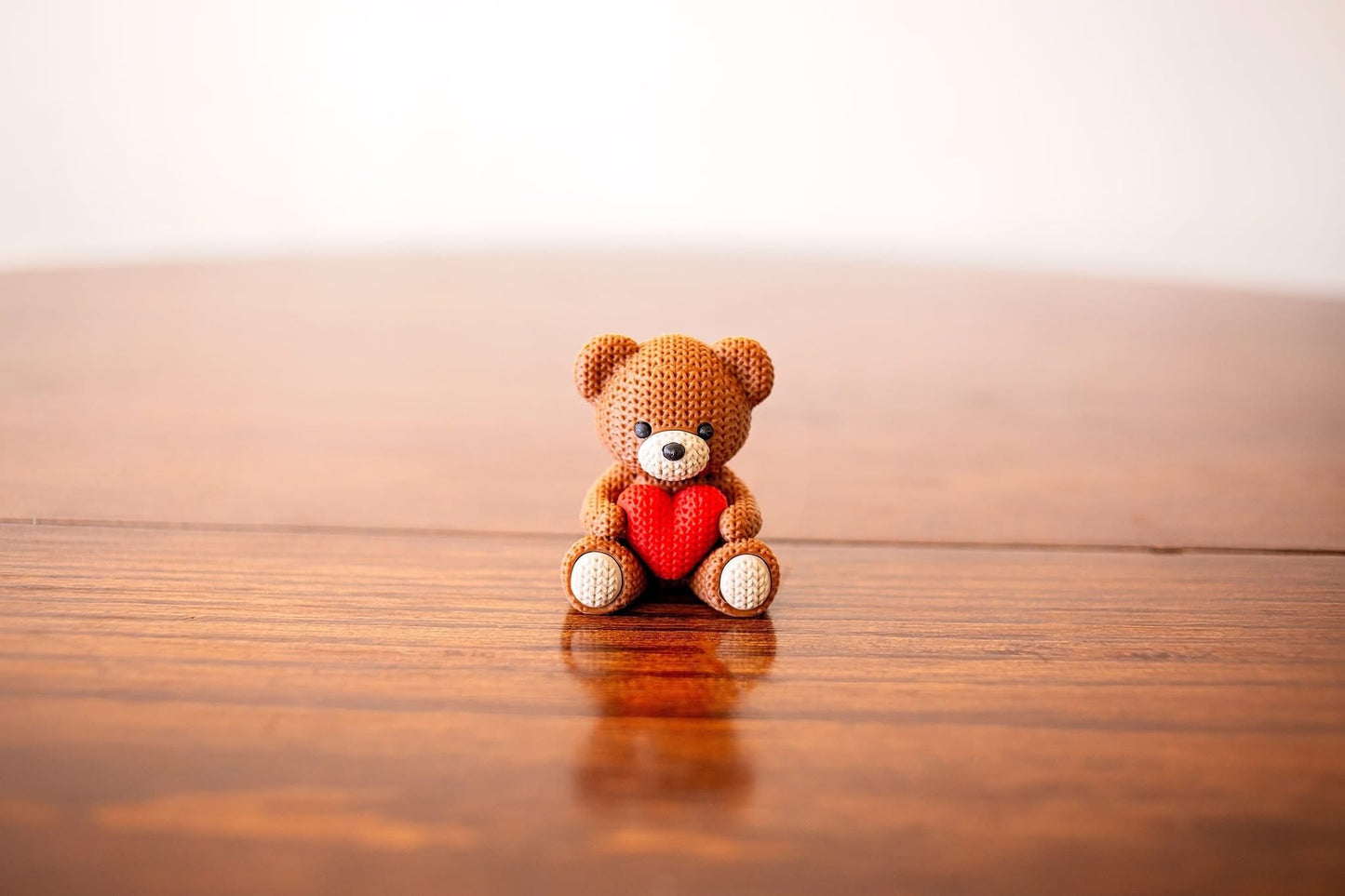 Hand-Knitted Teddy Bear with Heart Figurine